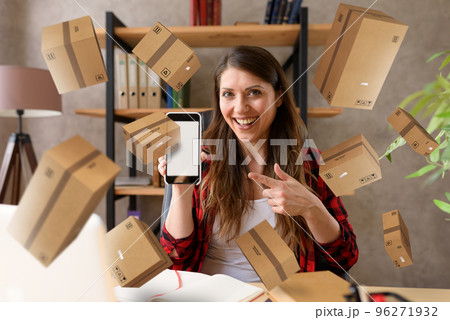 Woman does shopping through e-commerce online shop. Concept of fast delivery 96271932