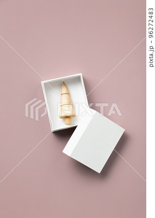 Christmas and New year concept. Miniature Christmas tree in a box Christmas and New year concept. Miniature Christmas tree in a box 96272483