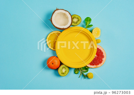 Composition of citrus fruit, orange and lemon, coconut, kiwi on cyan background Composition of citrus fruit, orange and lemon, coconut, kiwi on cyan background 96273003