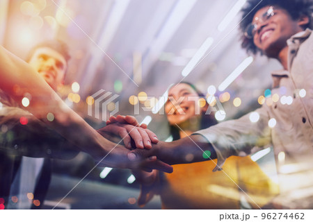 Business people putting their hands together. Concept of teamwork and partnership Business people putting their hands together. Concept of teamwork and partnership 96274462