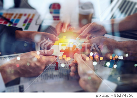 Teamwork of partners. Concept of integration and startup with puzzle pieces Teamwork of partners. Concept of integration and startup with puzzle pieces 96274556