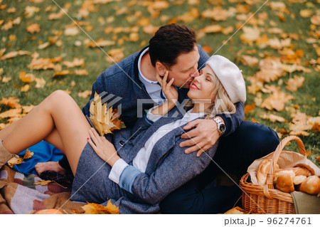Happy couple enjoying golden autumn spring season in the park Happy couple enjoying golden autumn spring season in the park 96274761
