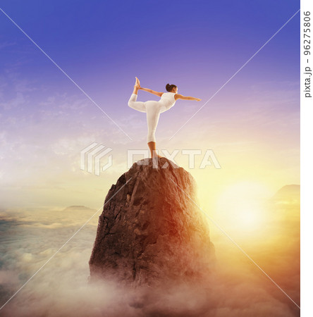 Yoga on top of the mountain 96275806