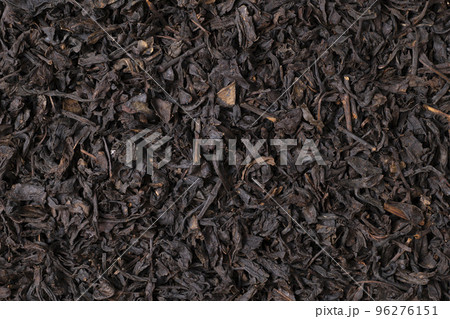 Black dried tea as a natural background. Black dried tea as a natural background. 96276151