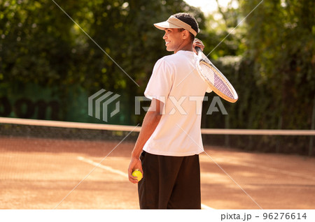 Man in sportswear at the tennis courts Man in sportswear at the tennis courts 96276614
