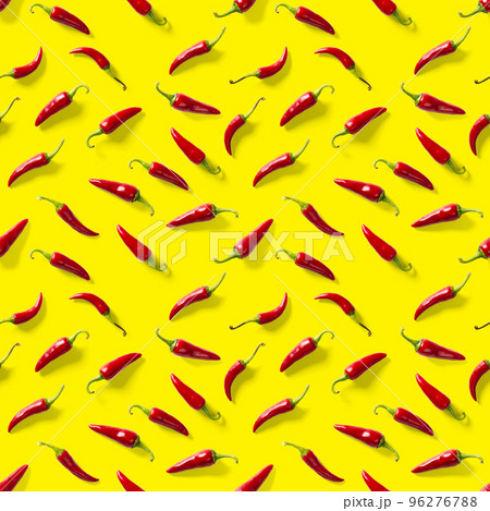 Seamless pattern made of red chili or chilli on yellow background. Minimal food pattern. Red hot chilli seamless peppers pattern. Food background. Seamless pattern made of red chili or chilli on yellow background. Minimal food pattern. Red hot chilli seamless peppers pattern. Food background. 96276788