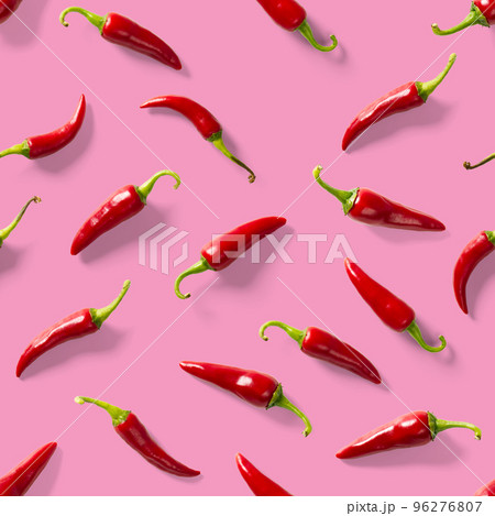 Seamless pattern made of red chili or chilli on pink background. Minimal food pattern. Red hot chilli seamless peppers pattern. Food background. Seamless pattern made of red chili or chilli on pink background. Minimal food pattern. Red hot chilli seamless peppers pattern. Food background. 96276807