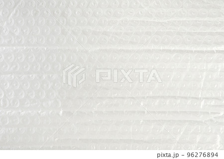Texture of soft film for packaging close-up. The texture of the packaging air-bubble film on the whole screen. Texture of soft film for packaging close-up. The texture of the packaging air-bubble film on the whole screen. 96276894