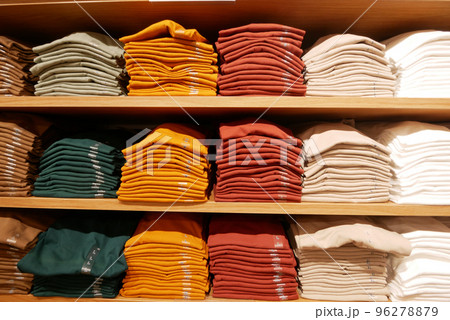 Close up of Colorful Shirts on shelf in a shop  96278879