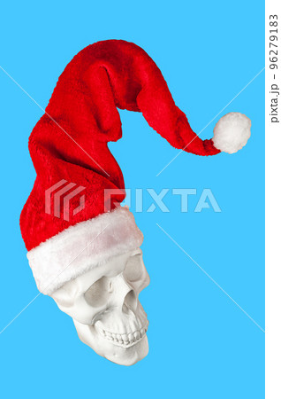 White spooky skull in bright red Santa Claus hat isolated on blue background. Funky hard xmas decor. Crazy concept of holidays, cool party, 2023 New Year and Merry Christmas. Winter funny holiday mood White spooky skull in bright red Santa Claus hat isolated on blue background. Funky hard xmas decor. Crazy concept of holidays, cool party, 2023 New Year and Merry Christmas. Winter funny holiday mood 96279183