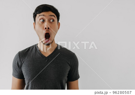 Funny amazing shocked surprised asian man face advertise isolated on white. 96280507