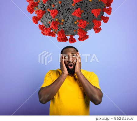 Fearful expression of a boy who is scared to catch the coronavirus. purple background. 96281916