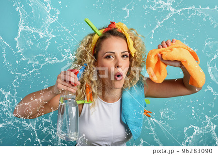 Funny housewife cleans and disinfects to keep germs, viruses and bacteria away. 96283090
