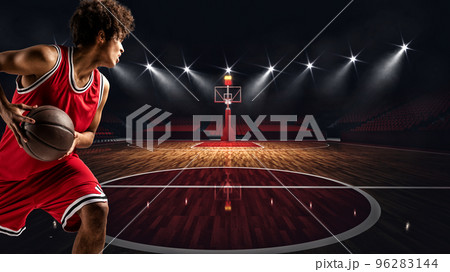 Young African American boy with basketball in the middle of the stadium ready to go to the basket Young African American boy with basketball in the middle of the stadium ready to go to the basket 96283144