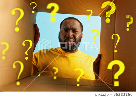 Man have doubt and he is disgusted about what is inside a package. concept of online shop fraud 96283166