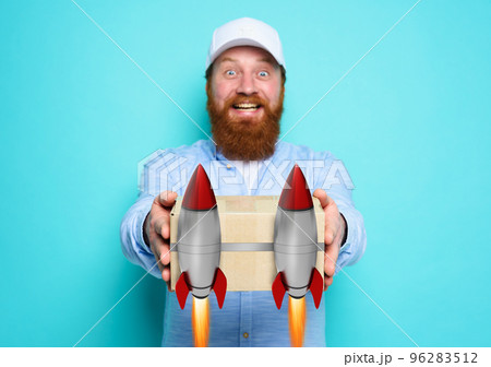 Courier is happy to deliver a fast carton box like a rocket. concept of priority and express transport service. Cyan background 96283512