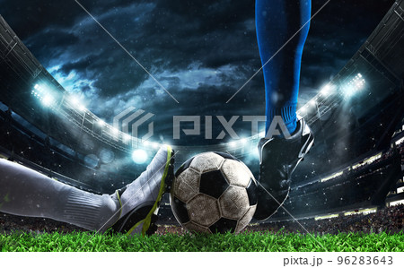 Close up of a football action scene with competing soccer players at the stadium 96283643