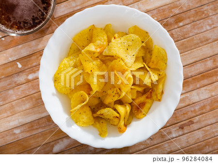 Crispy potato chips with glass of cold beer 96284084