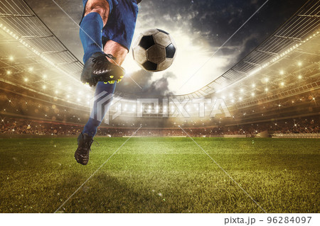 Close up of a striker who kicks the ball to make goals at the stadium during a soccer game Close up of a striker who kicks the ball to make goals at the stadium during a soccer game 96284097