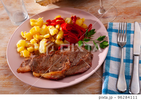 Beef entrecote with fried potato and baked sweet pepper Beef entrecote with fried potato and baked sweet pepper 96284111