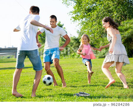 Happy family playing football 96284286