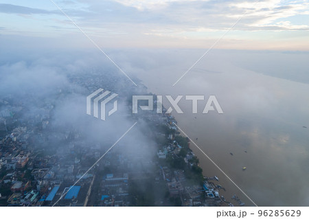 Aerial view of Varanasi city with  Ganges river, ghats, the houses in Varanasi, Banaras, Uttar Pradesh, India Aerial view of Varanasi city with  Ganges river, ghats, the houses in Varanasi, Banaras, Uttar Pradesh, India 96285629