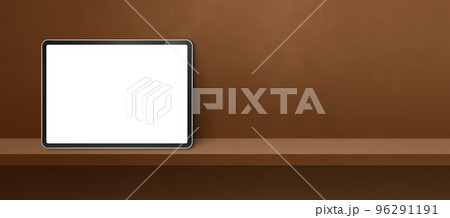 Digital tablet pc on brown wall shelf. Background banner 96291191