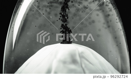 Miniature volcano erupting black lava 96292724