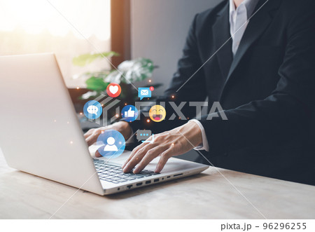 Chat and notification on notebook with emoji social media icon. businessman hand typing laptop on vacation with hologram. Social media and digital online concept. Chat and notification on notebook with emoji social media icon. businessman hand typing laptop on vacation with hologram. Social media and digital online concept. 96296255