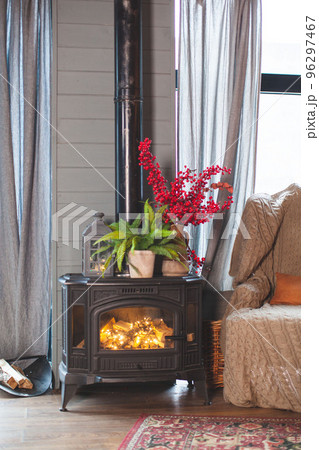 Fireplace, Christmas decor. Chalet interior. Fireplace, Christmas decor. Chalet interior. 96297467