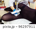 Anti-cellulite massage procedure in the cosmetologist's office. LPG massage for slender and beautiful women's legs. 96297911
