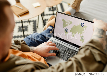 Close up of man with disability using laptop 96299035