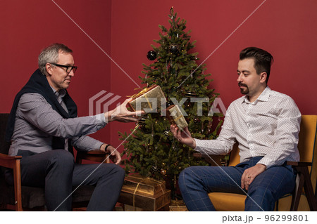 Attractive elderly man and his adult son 96299801