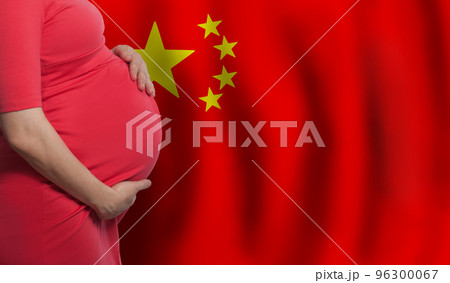 Pregnant woman belly on Chinese flag background Pregnant woman belly on Chinese flag background 96300067