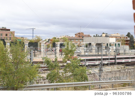 Train. Train tracks. Train entering a station. Subway leaving the station. Means of transport in Madrid, in Spain. Horizontal photography. 96300786