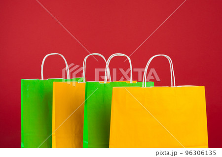 Arrangement of shopping bags on red background Arrangement of shopping bags on red background 96306135