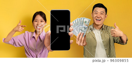Smiling black asian enjoying victory on yellow, gambling online, mockup Smiling black asian enjoying victory on yellow, gambling online, mockup 96309855