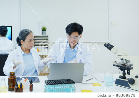 medical research laboratories, scientists analyze chemical samples Discuss technological innovations. Advanced scientific laboratories for medicine, biotechnology 96309879