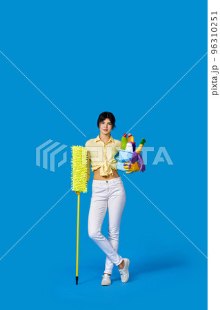 woman in rubber gloves with cleaning supplies 96310251