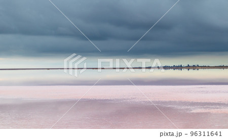 Salt pink lake reflective mirror with epic clouds Salt pink lake reflective mirror with epic clouds 96311641