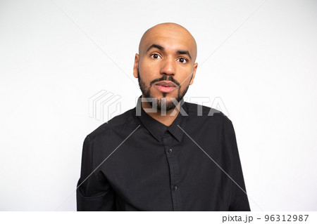 Portrait of surprised young businessman staring at camera 96312987