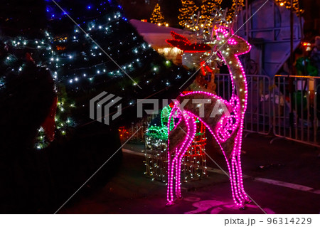 Illuminated Christmas deer at night. Decoration for Christmas and New Years holidays in a city park 96314229