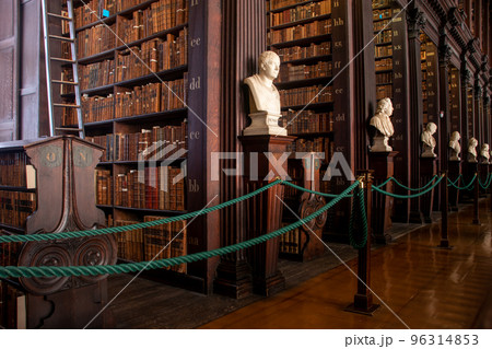 Ancient bookshelves with letters in Trinity college library, Dublin, Ireland 96314853