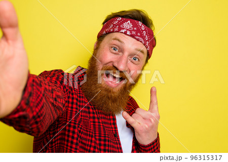 Happy man with beard and bandana in head Happy man with beard and bandana in head 96315317