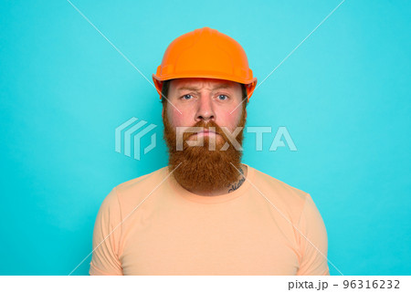 Worker with yellow hat is confused about his work Worker with yellow hat is confused about his work 96316232
