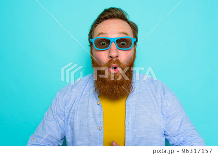 Man with beard and sunglasses is wondered and happy 96317157