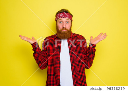 Undecided man with beard and bandana in head Undecided man with beard and bandana in head 96318219