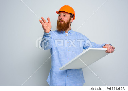 Confidant architect with beard and orange helmet does a sketch Confidant architect with beard and orange helmet does a sketch 96318698