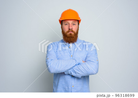 Isolated confidant architect with beard and orange helmet Isolated confidant architect with beard and orange helmet 96318699