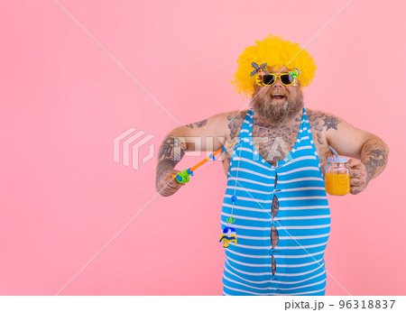 Fat happy man with beard and sunglasses have fun with the fishing pole Fat happy man with beard and sunglasses have fun with the fishing pole 96318837